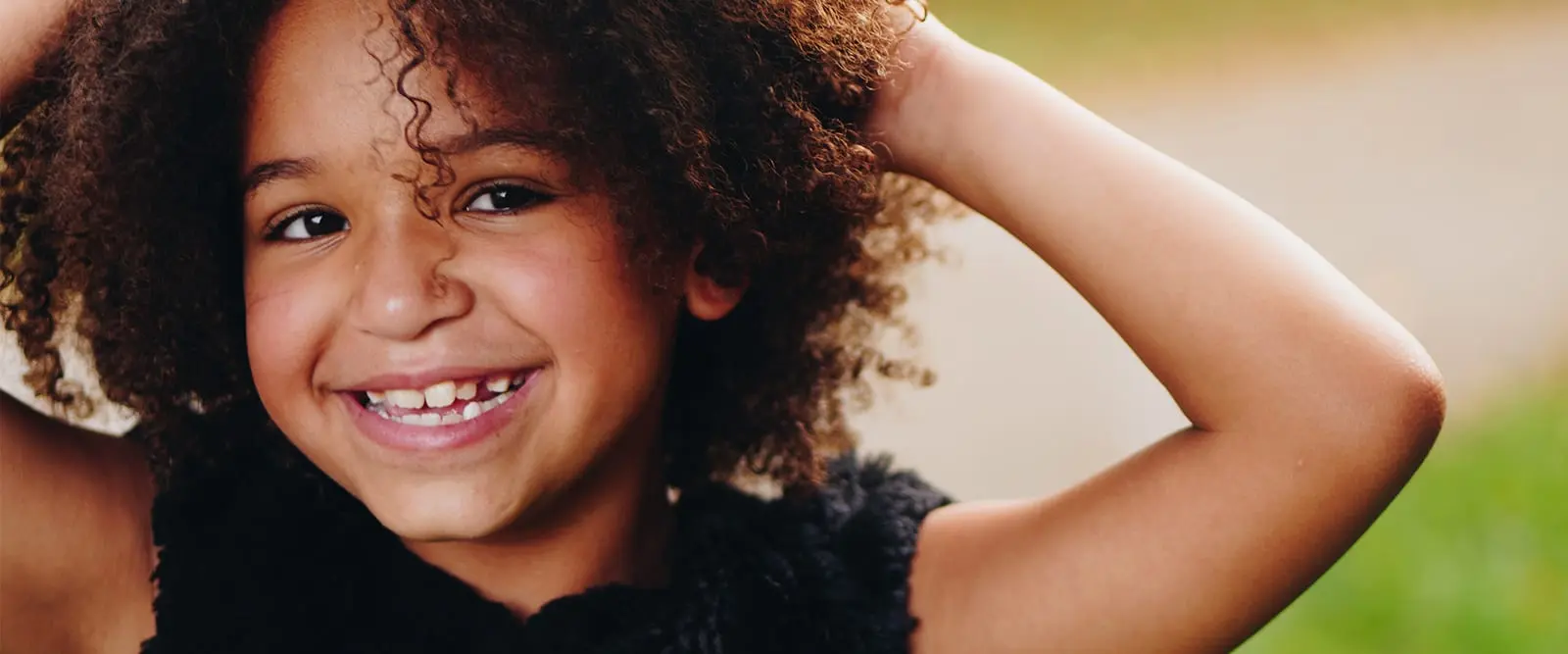 Happy child receiving gentle dental care at London Square Dental Calgary