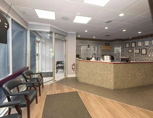 Physical barrier at reception desk - London Square Dental Calgary