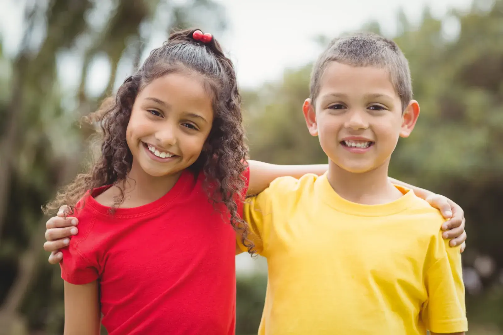 Happy children with healthy smiles after cavity prevention